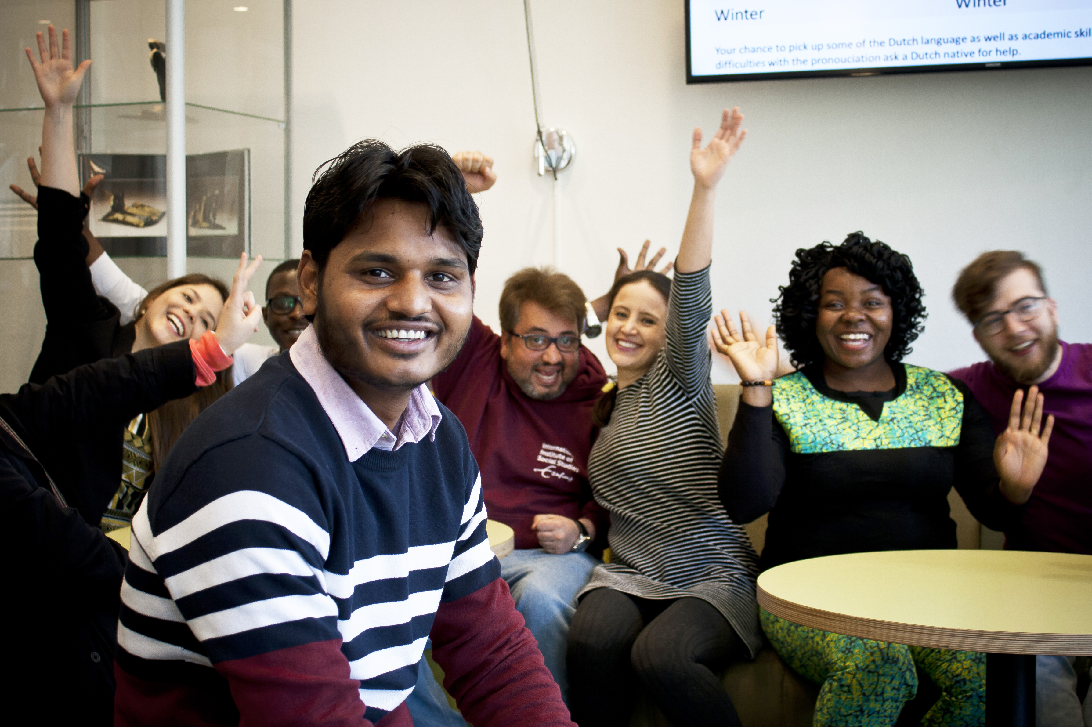 Students in lobby - waving - 2018