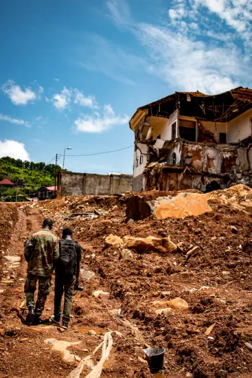Mudslide in Sierra Leone - destroyed house on top of hill - When disaster meets conflict