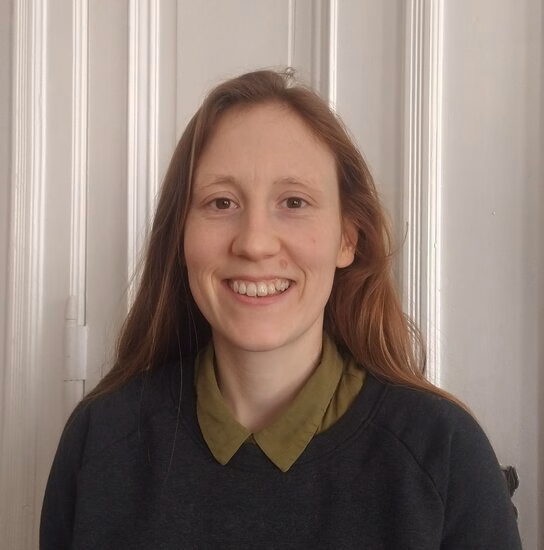 A portrait of Kate O'Donnell. In this picture, Kate stands face forward to the camera.
