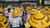 Myanmar - people sitting in yellow hats