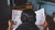 Woman reading newspaper - photo taken from behind