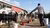 Milk farmer carrying feed to cows
