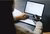 Woman with metal hand working on laptop