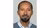 Tsegaye Moreda headshot wearing light blue shirt and darker jumper
