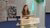 Nina Swen in green top standing behind lectern during her PhD defence