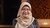 Nurul Indarti wearing peach-coloured headscarf and patterned shirt