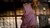Woman with lilac shawl covering head and face