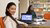 Smiling student working in library