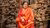 Woman sitting in front of a building under reconstruction in Bhaktapur, 2017, Nepal