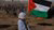 Woman holding Palestinian flag at Israel-Gaza border