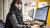 Student using the PC near the lounge area