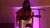 Artist Lois Ava is seen playing guitar and singing.