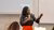 Daphina Misiedjan describing event programme to a crowd