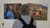 Rural Women's Assembly (RWA) seed guardians exhibition - person looking at 2 photos