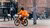 Man cycling on a Thuisbezorgd delivery bike.