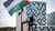Man flying Palestinian flag in front of ICC in The Hague