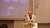 Tammam Aloudat speaks at a podium during the The Hague Humanitarian Studies Conference