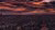 Kampala at night - aerial view with red sky