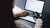 Woman with metal hand working on laptop