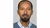 Tsegaye Moreda headshot wearing light blue shirt and darker jumper