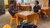 Roland sits across a interview participant in a Chicheria, a social space common in Peru