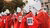 Women in Handmaid’s Tale costumes holding signs reading ‘Aborto Legal Ya’ at a protest