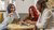 Three students sitting in the student lounge