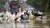 Waist-deep in water due to flooding