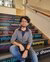 Rupankar Dey, recent alumni sits on the ISS stairs