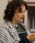 Side view of Emmylou Savage wearing Palestinian keffiyeh