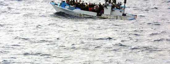 Boat with refugees on water